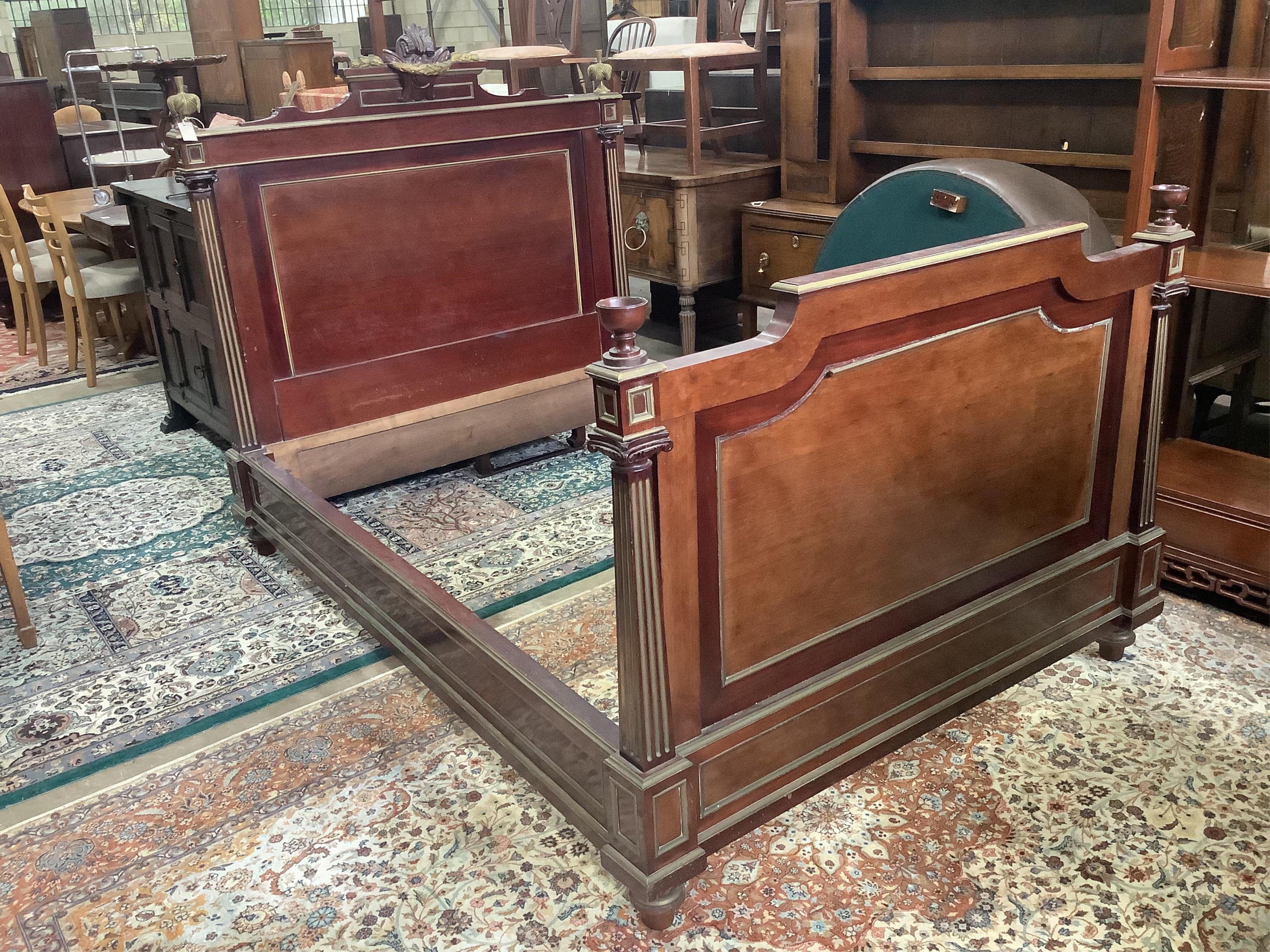 A Napoleon III brass mounted mahogany double bedframe, width 148cm, length 210cm, height 150cm. Condition - fair